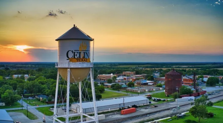 Aerial view of the Celina, Texas water tower at sunset overlooking downtown