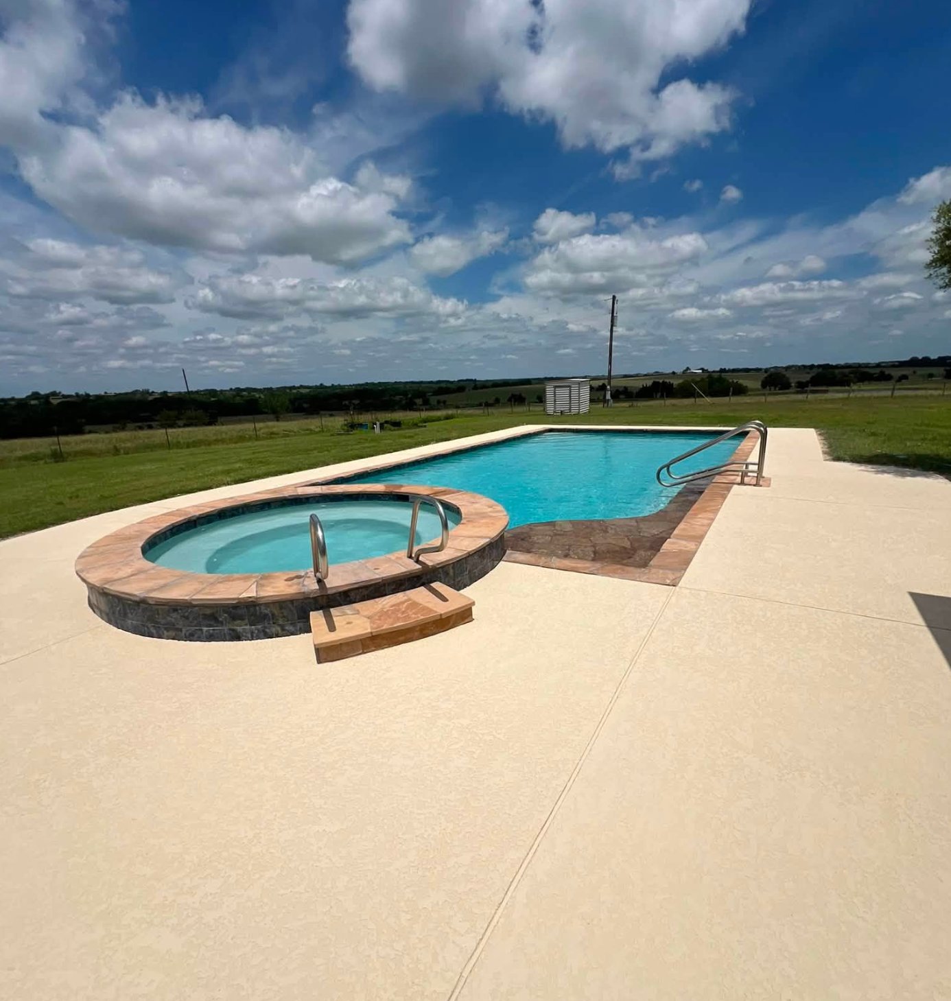 Same pool deck after a new spray deck coating was applied over the existing aggregate concrete