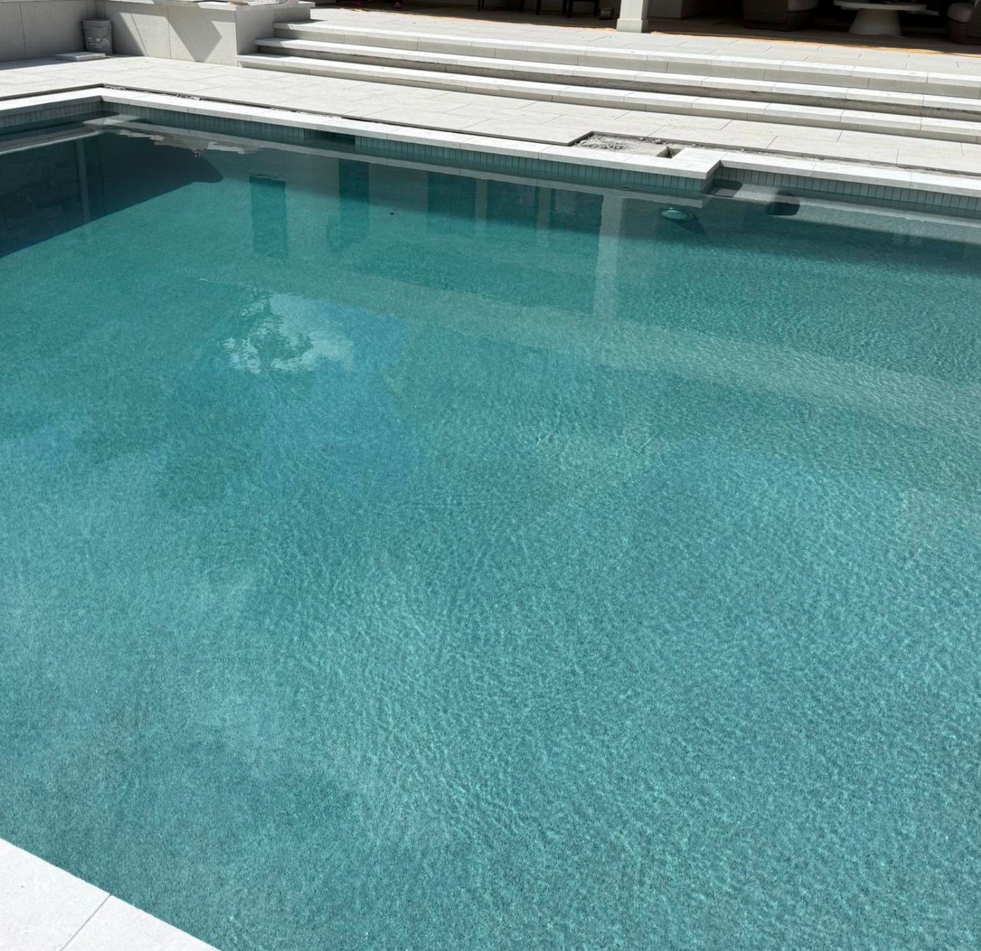 Same French Grey pebble pool finish filled with water