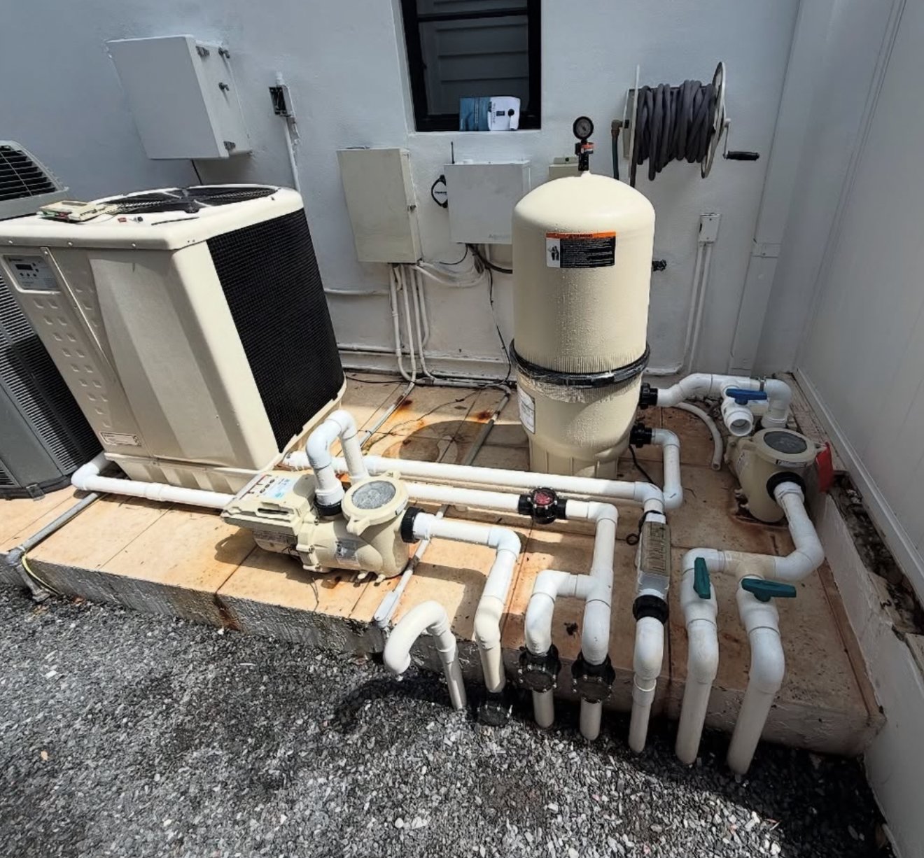Pool heater and cartridge filter equipment pad serviced by The Texas Pool Company