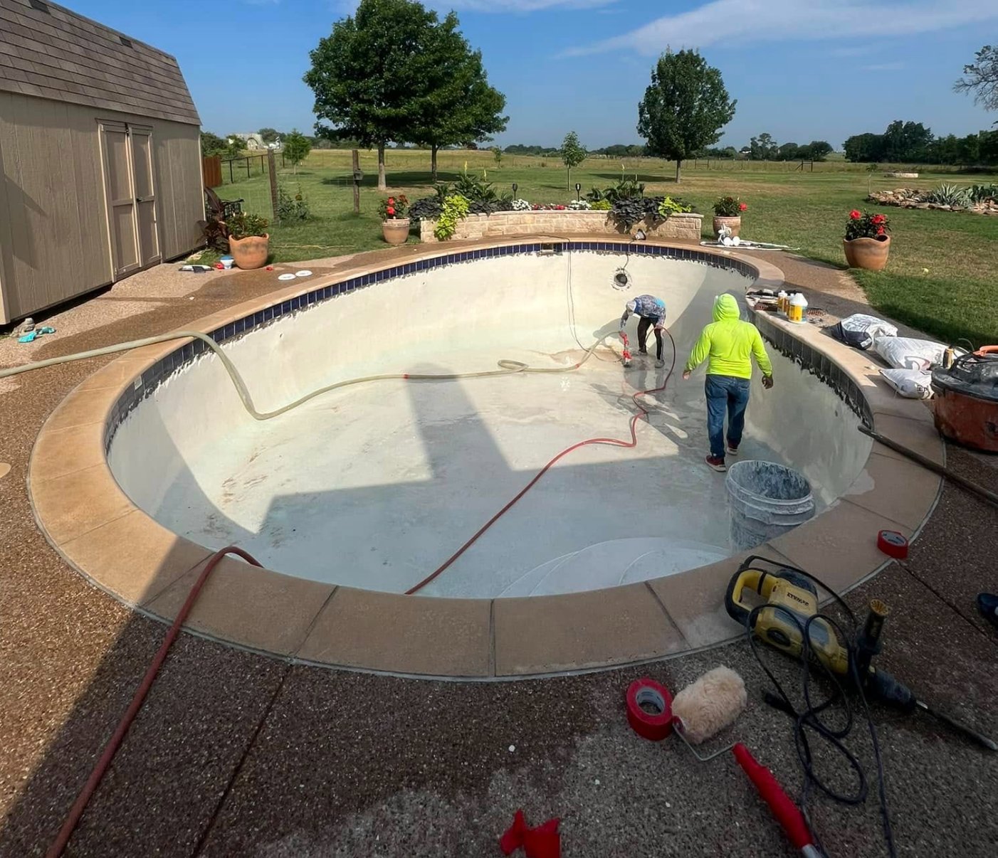Pool with old plaster chipped out before replastering with Midnight Blue pebble