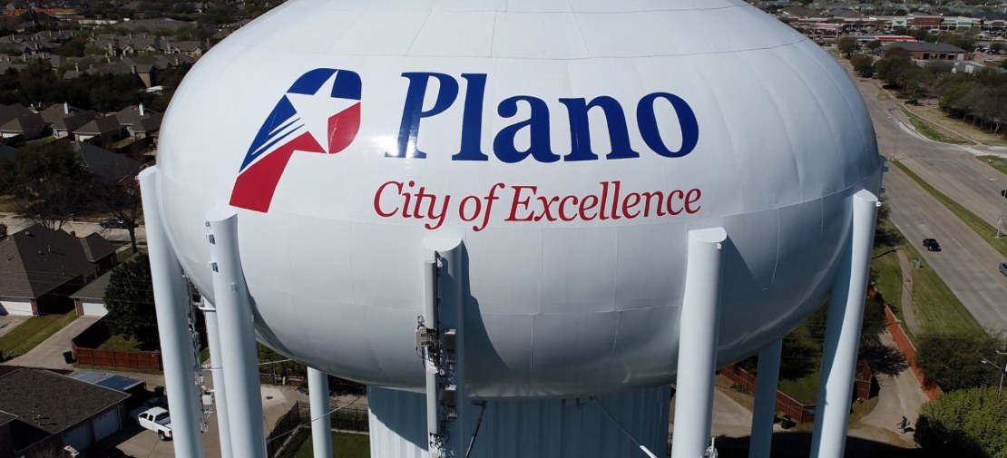 Aerial view of the Plano, Texas water tower reading City of Excellence